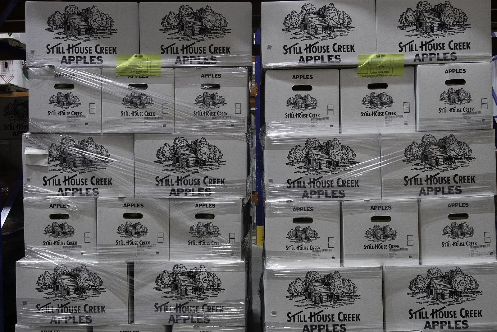 Boxes of apples stacked for food distribution
